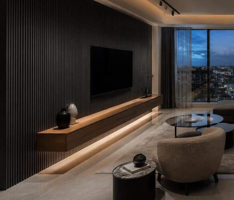 Charcoal fluted TV wall with floating walnut console